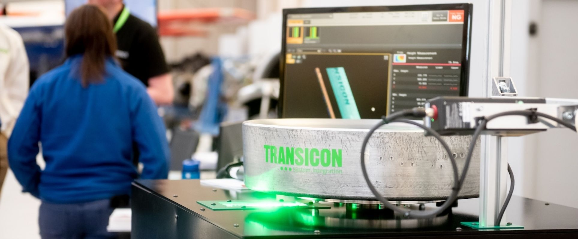 A Transicon logo is seen on a piece of equipment at a manufacturing expo.
